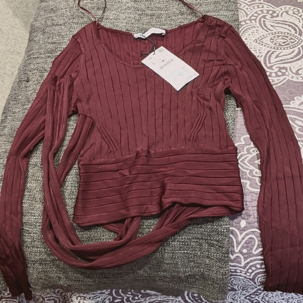 Burgundy long sleeve blouse.